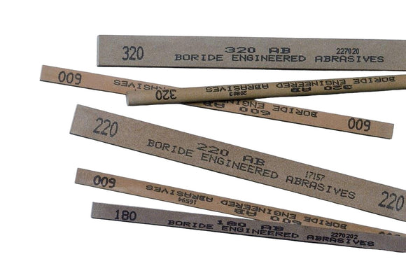 Set of Boride Engineered Abrasives with various grit numbers on a white background